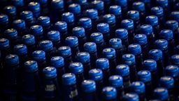 Aluminum bottles of Bud Light brand beer move along a conveyor at an Anheuser-Busch InBev NV facility in St. Louis, Missouri, U.S., on Monday, July 16, 2018. "Because beer is increasingly packaged in aluminum cans, the proposed 10 percent tariff on aluminum will likely cost U.S. brewers millions of dollars," the company said in a statement. Photographer: Alex Flynn/Bloomberg via Getty Images