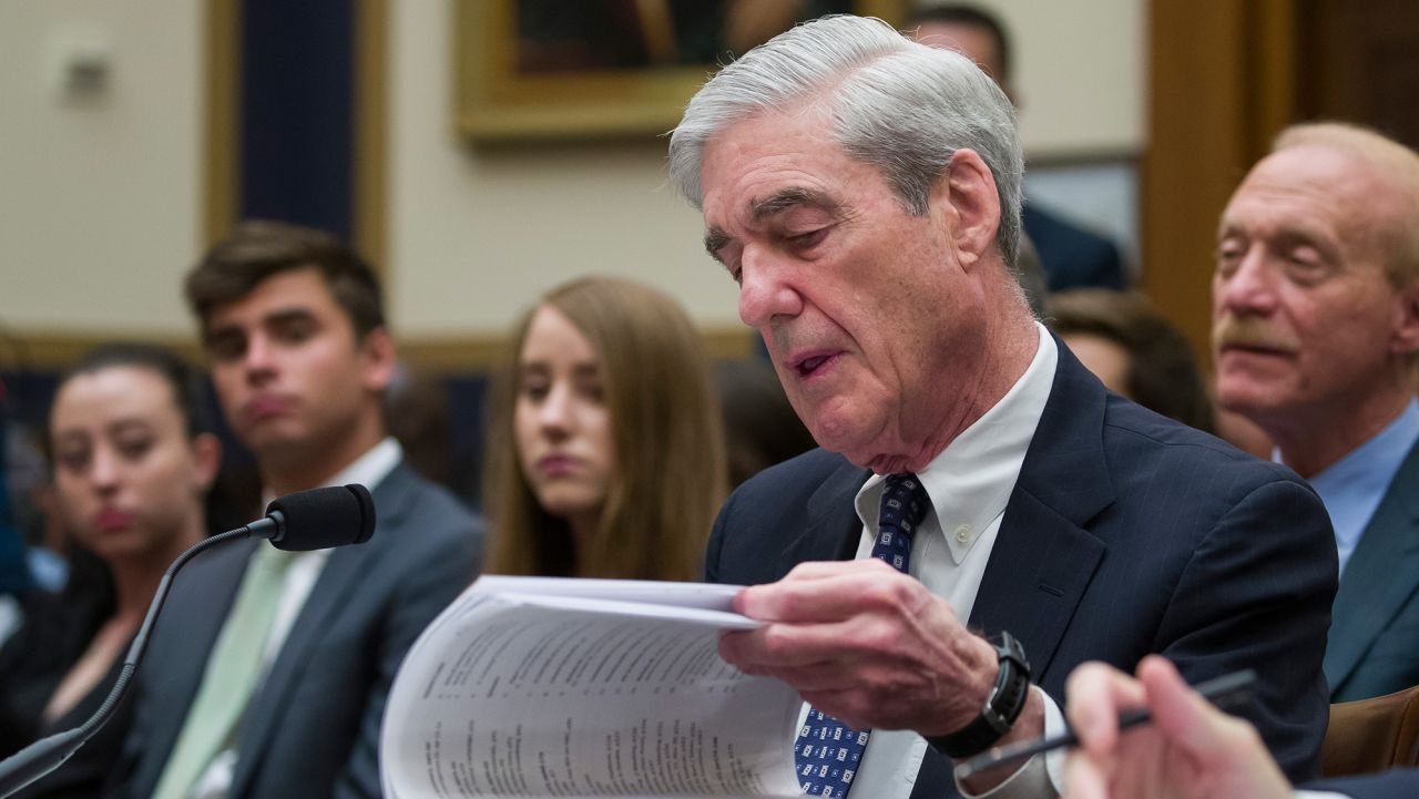 Former special counsel Robert Mueller checks a binder as testifies before the House Judiciary Committee hearing on his report on Russian election interference, on Capitol Hill, Wednesday, July 24, 2019, in Washington. (AP Photo/Alex Brandon)