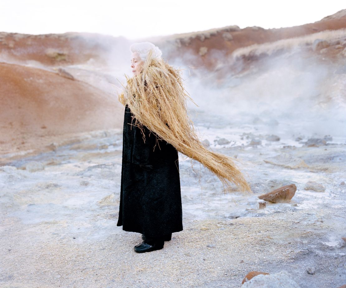Edda, pictured here dressed "like an ethereal oracle" among steaming Icelandic hot springs. A national myth claims that hot springs birds representing the souls of the dead dive into the rising bubbles.