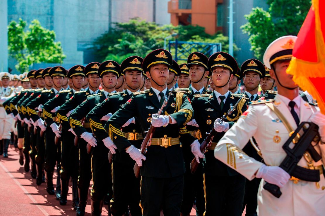 Soldiers of the PLA march during an open day at the Ngong Shuen Chau Barracks in Hong Kong on June 30.