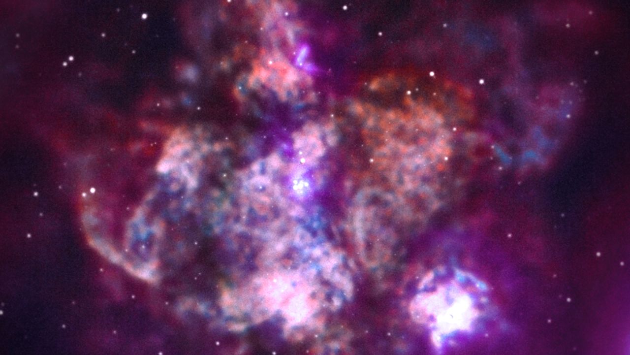 This is 30 Doradus, one of the largest regions of star formations close to our galaxy. Here, thousands of stars are releasing material and radiation, accelerated by powerful wind.