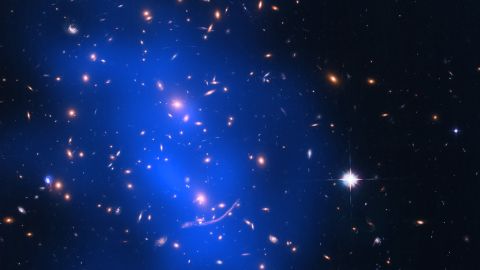 Galaxy cluster Abell 370 contains several hundred galaxies 4 billion light years from Earth.