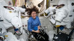 Expedition 60 Flight Engineer Christina Koch of NASA works inside the Quest joint airlock.