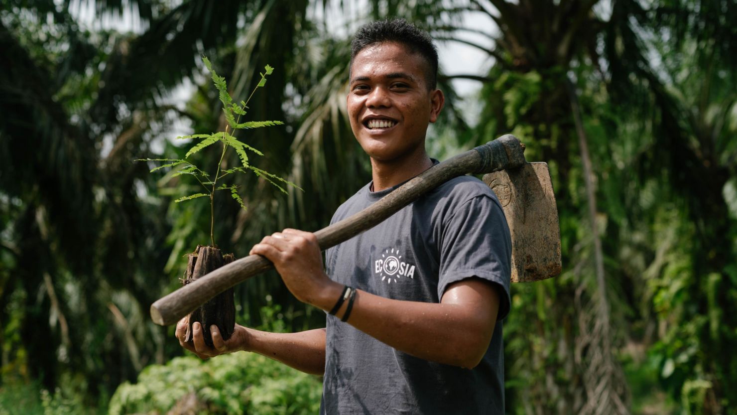 A tree planter working in association with Ecosia in Indonesia.