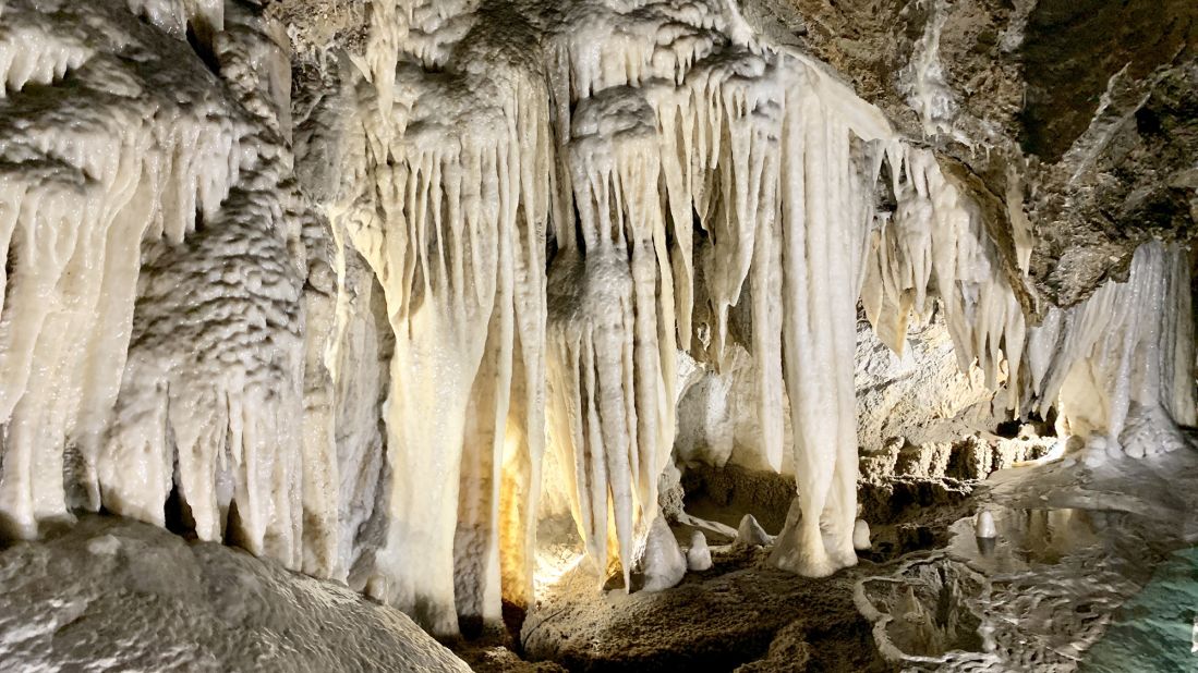 <strong>Natural wonders: </strong>At the Grotta del Vento (wind cave), water seeps through porous limestone, continuing to shape calcium carbonate into fang-like stalactites and gleaming alabaster draperies while feeding a crystalline underground stream.