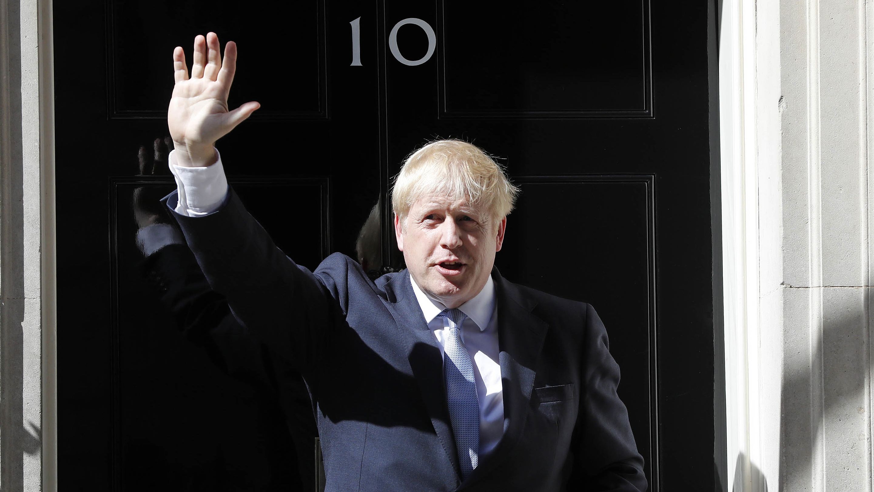 Boris Johnson waves from the steps of No. 10 Downing Street after giving a statement in London in July 2019. He had just become prime minister.