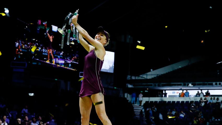 SINGAPORE - OCTOBER 28:  Elina Svitolina of the Ukraine poses with the Billie Jean King trophy after her win against Sloane Stephens of the United States during the Women's singles final match on Day 8 of the BNP Paribas WTA Finals Singapore presented by SC Global at Singapore Sports Hub on October 28, 2018 in Singapore.  (Photo by Yong Teck Lim/Getty Images for the WTA)