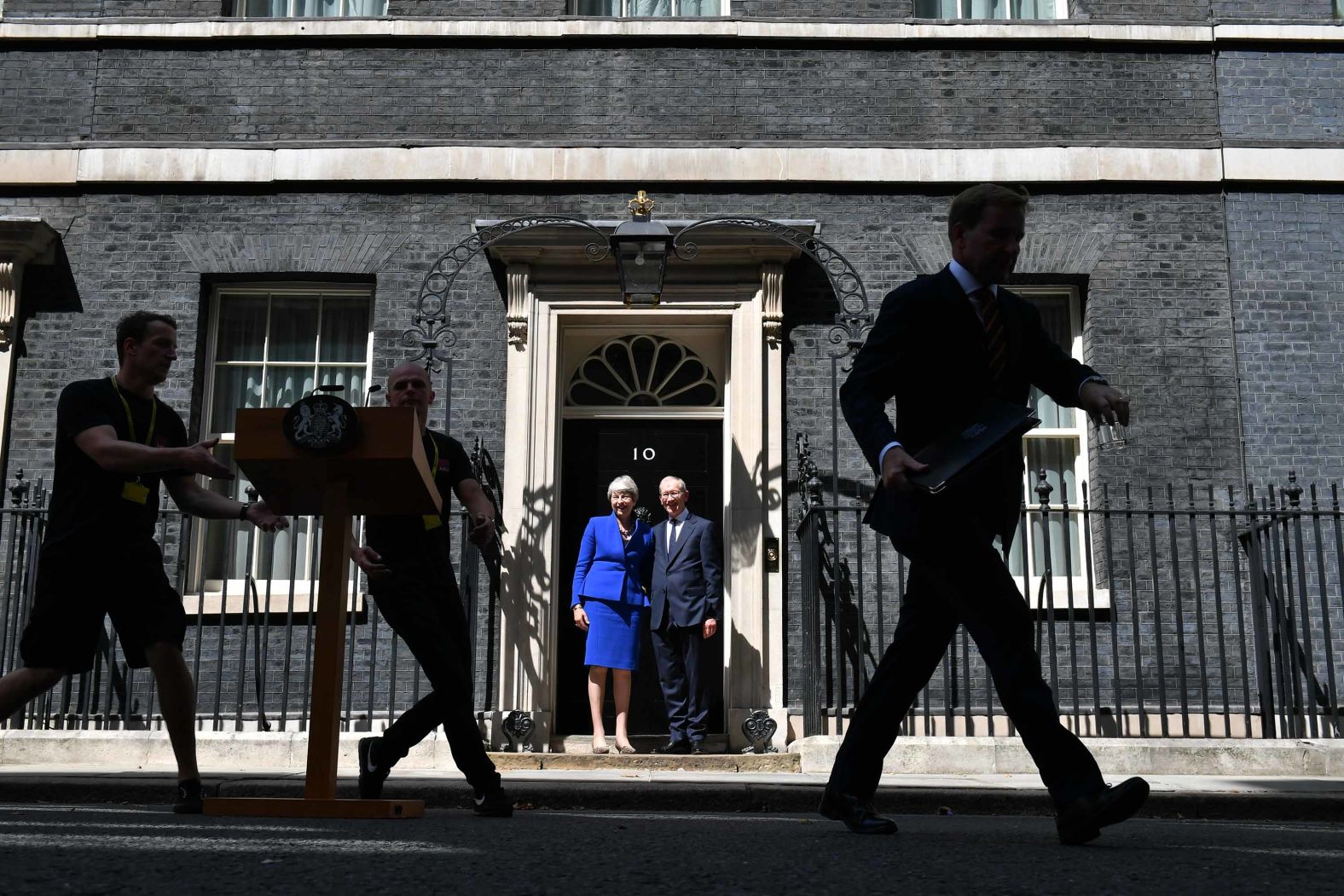 May and her husband, Philip, stand in front of No. 10 Downing Street before delivering her resignation to Queen Elizabeth II.