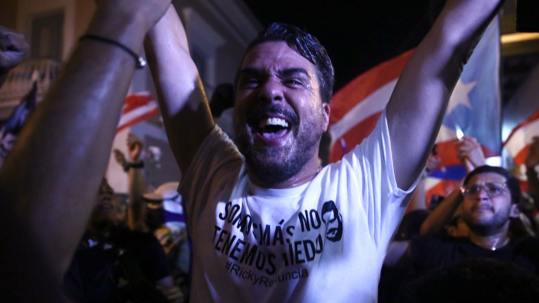 A demonstrator rejoices after Rosselló announced his resignation.