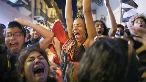 Jubilant demonstrators are seen in the streets of Old San Juan.