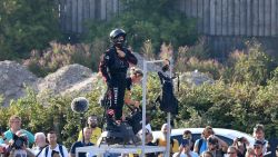 Zapata CEO Franky Zapata (C) prepares before an attempt of a flight across the Channel standing on a jet-powered "flyboard" on July 25, 2019 in Sangatte, northern France. - Franky Zapata, a former jet-skiing champion, aims to soar above the Channel "like a bird" in the crossing from northern France to southern England, in a scene likely to resemble a science fiction film. In a tribute to past aviation heroes, the 40-year-old has picked the day that marks 110 years since pioneer Louis Bleriot made the first airplane flight across the Channel on July 25, 1909. (Photo by Denis Charlet / AFP)        (Photo credit should read DENIS CHARLET/AFP/Getty Images)