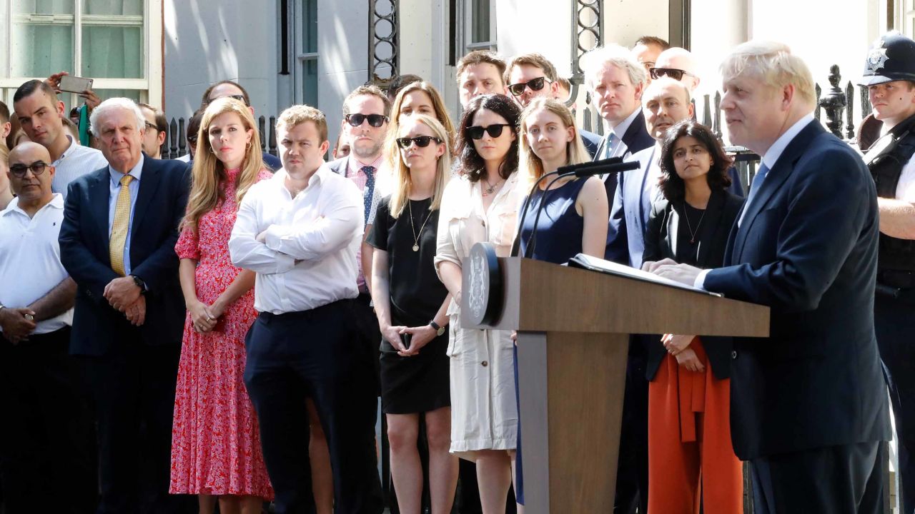Boris Johnson delivers his first speech as UK prime minister, watched by Carrie Symonds and staff.
