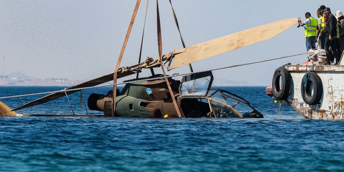 A decommissioned Jordanian Armed Forces' AH-1 Cobra helicopter is submerged into the waters of the Red Sea as part of preparations for a new underwater military museum. 