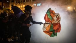 HONG KONG, HONG KONG - JULY 21: Protesters clash with police amid tear gas after taking part in an anti-extradition bill march on July 21, 2019 in Hong Kong, China. Pro-democracy protesters have continued weekly rallies on the streets of Hong Kong against a controversial extradition bill since  June 9, as the city plunged into crisis after waves of demonstrations and several violent clashes. Hong Kong's Chief Executive Carrie Lam apologized for introducing the bill and recently declared it "dead", however protesters have continued to draw large crowds with demands for Lam's resignation and completely withdraw the bill. (Photo by Chris McGrath/Getty Images)