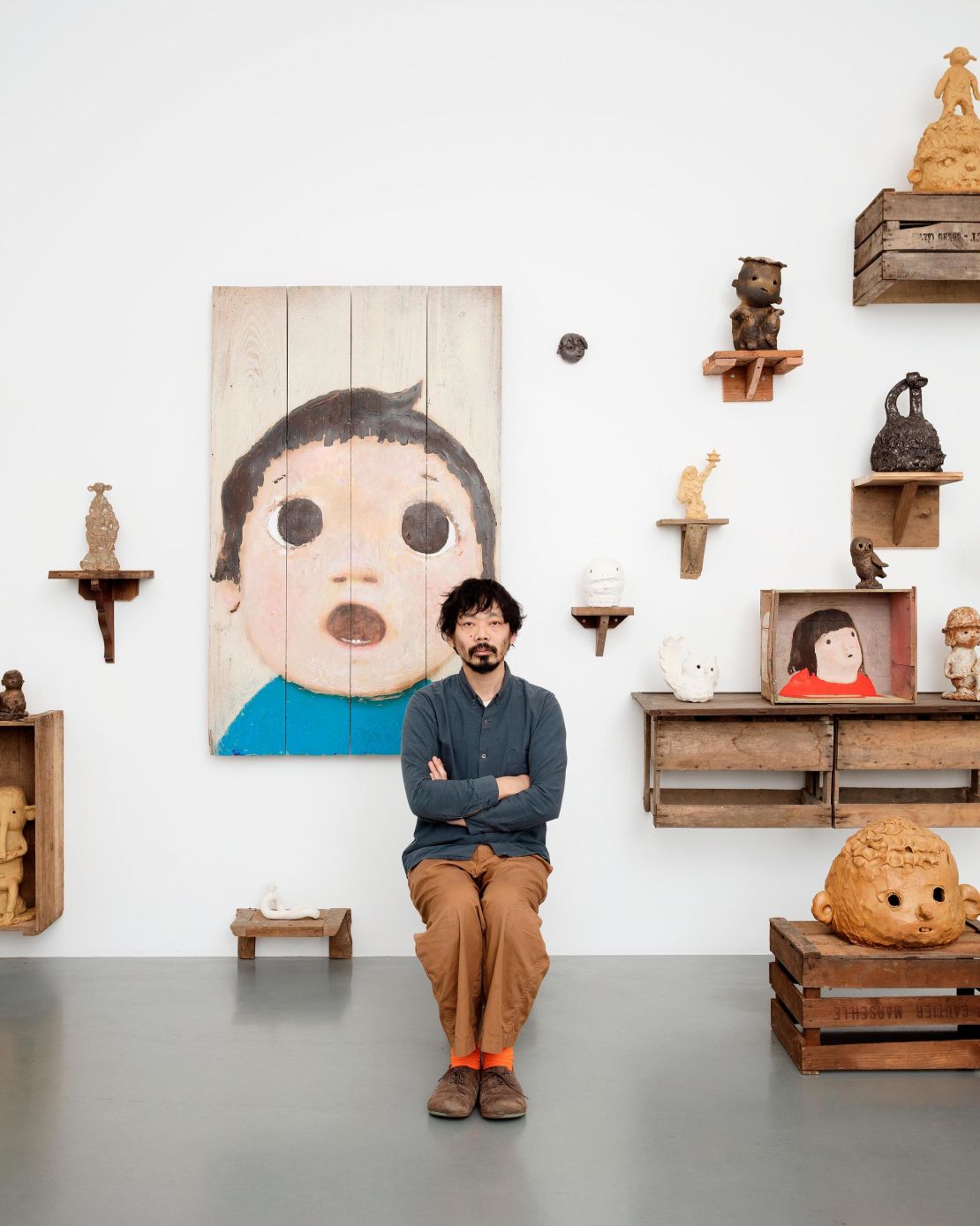 Otani with a selection of his sculptures, paintings and ceramic artworks.