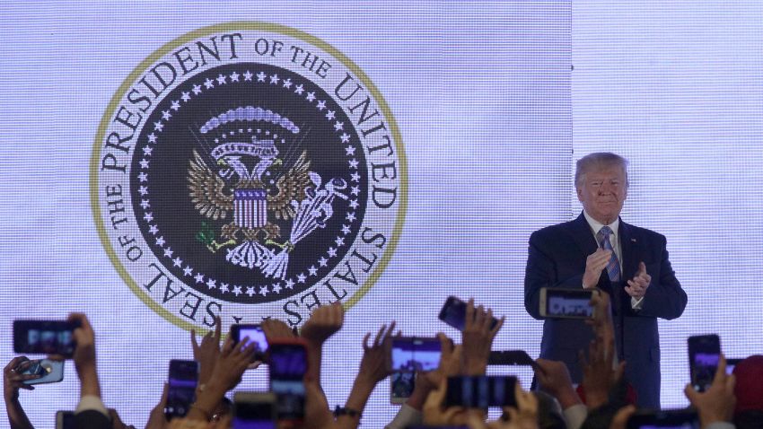 WASHINGTON, DC - JULY 23:  U.S. President Donald Trump applauds in front of a doctored presidential seal with a double headed eagle and a set of golf clubs as he arrives to address the Teen Student Action Summit July 23, 2019 in Washington, DC. Conservative high school students gathered for the 4-day invited-only conference hosted by Turning Point USA to hear from conservative leaders and activists, receive activism and leadership training, and network with other attendees and organizations from across the U.S. (Photo by Alex Wong/Getty Images)