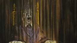 A cameraman works next to Irish artist Francis Bacon's painting "Study after Velázquez's Portrait of Pope Innocent X" exhibited at Prado Museum in Madrid, on January 30, 2009. The exhibition will run from 3rd of February to the 19th of April 2009. AFP PHOTO/ PIERRE-PHILIPPE MARCOU (Photo credit should read PIERRE-PHILIPPE MARCOU/AFP/Getty Images)