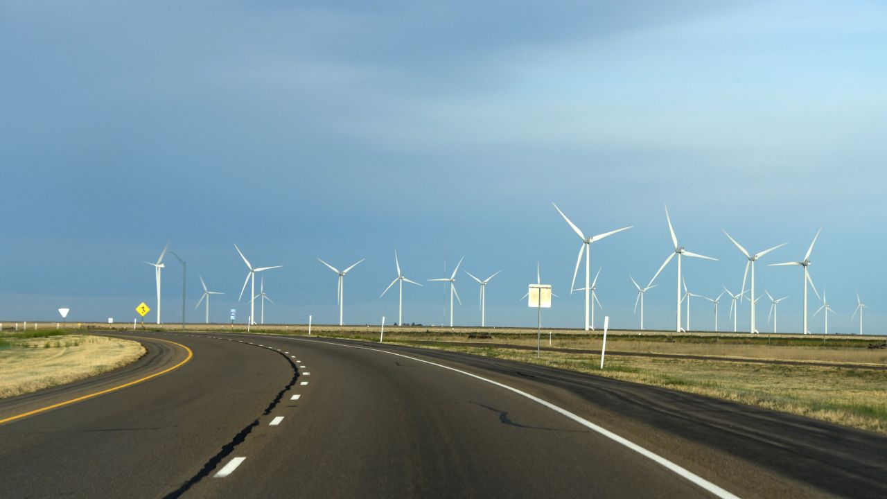Windmills spin near Adrian, Texas, next to Interstate 40. 
