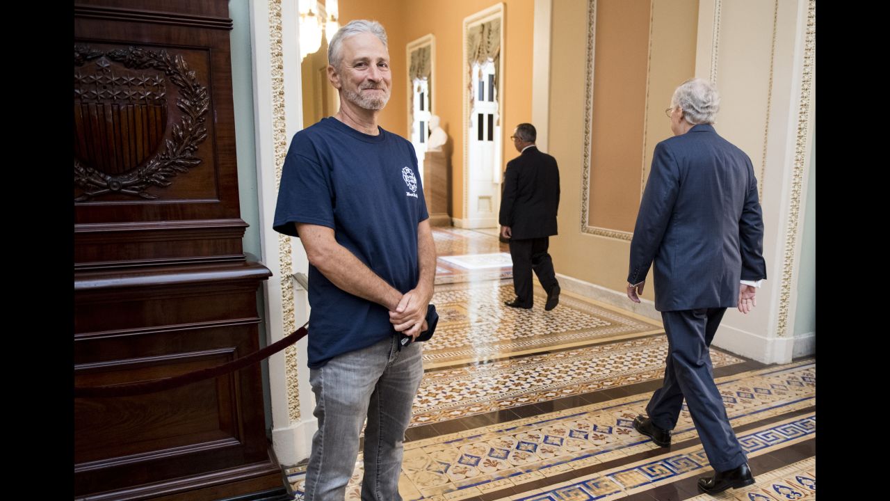 Comedian Jon Stewart smiles as Senate Majority Leader Mitch McConnell walks by him on Capitol Hill on Tuesday, July 23. Stewart, who was in Washington to advocate for an extension of the 9/11 Victim Compensation Fund, has been sharply critical of McConnell in the past. Later in the day, <a href="https://www.cnn.com/2019/07/24/politics/john-feal-jon-stewart-9-11-fund-cnntv/index.html" target="_blank">the Senate passed the extension,</a> which would permanently compensate individuals who were injured during the 2001 terrorist attacks or the cleanup and rescue efforts.