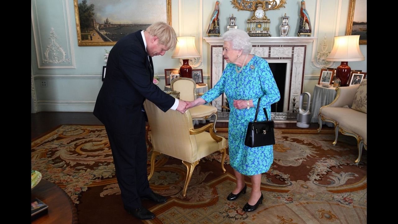 Britain's Queen Elizabeth II welcomes <a href="https://www.cnn.com/2019/07/23/uk/gallery/boris-johnson/index.html" target="_blank">Boris Johnson</a> at Buckingham Palace, where she formally invited him to become Prime Minister on Wednesday, July 24. Johnson <a href="https://edition.cnn.com/2019/07/23/uk/boris-johnson-prime-minister-uk-gbr-intl/index.html" target="_blank">won the UK's Conservative Party leadership contest</a> on Tuesday. He replaces Theresa May, who was forced into resigning after members of her Cabinet lost confidence in her inability to secure the UK's departure from the European Union.