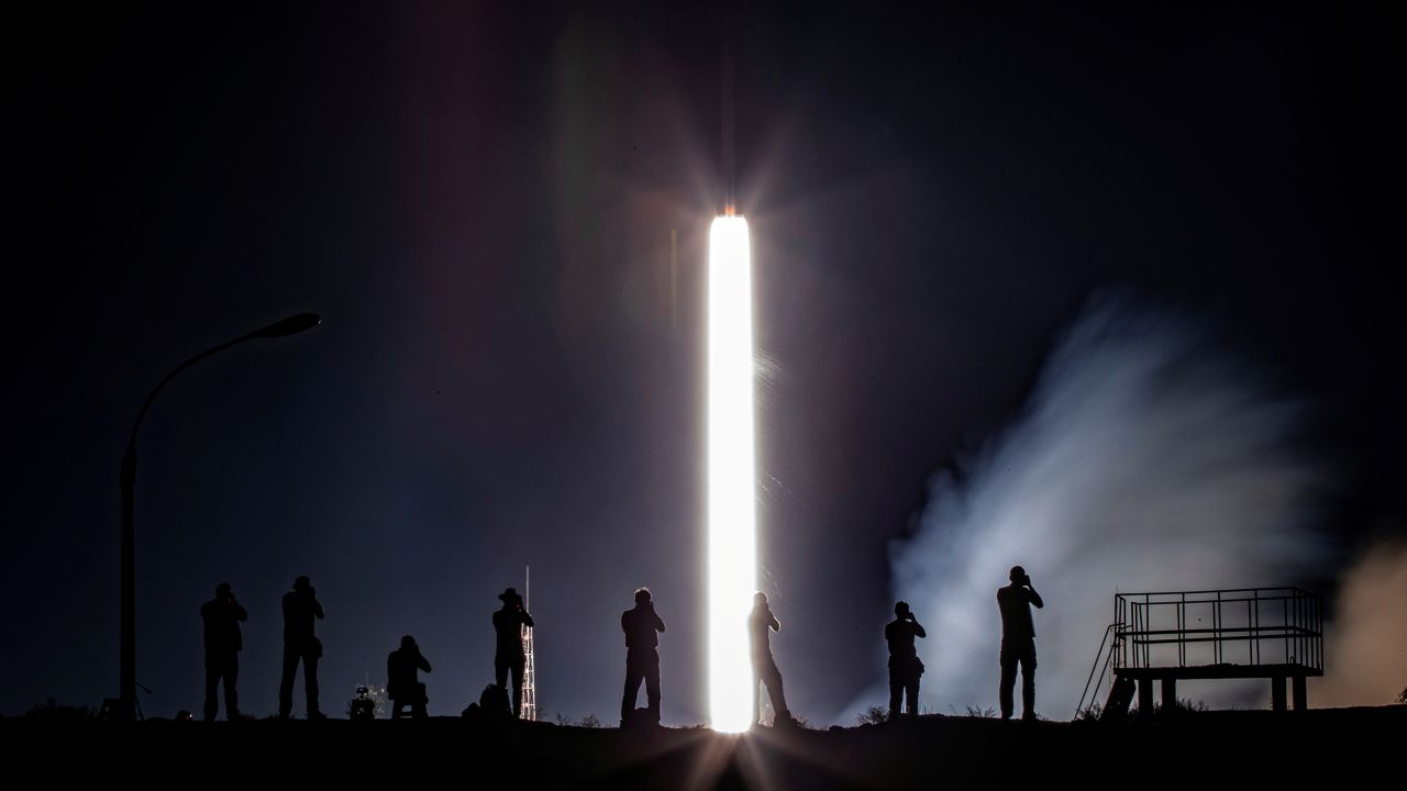Photographers take pictures of the Soyuz MS-13 spacecraft as it blasts off from Kazakhstan's Baikonur Cosmodrome on Saturday, July 20. It was carrying a new three-person crew to the International Space Station.