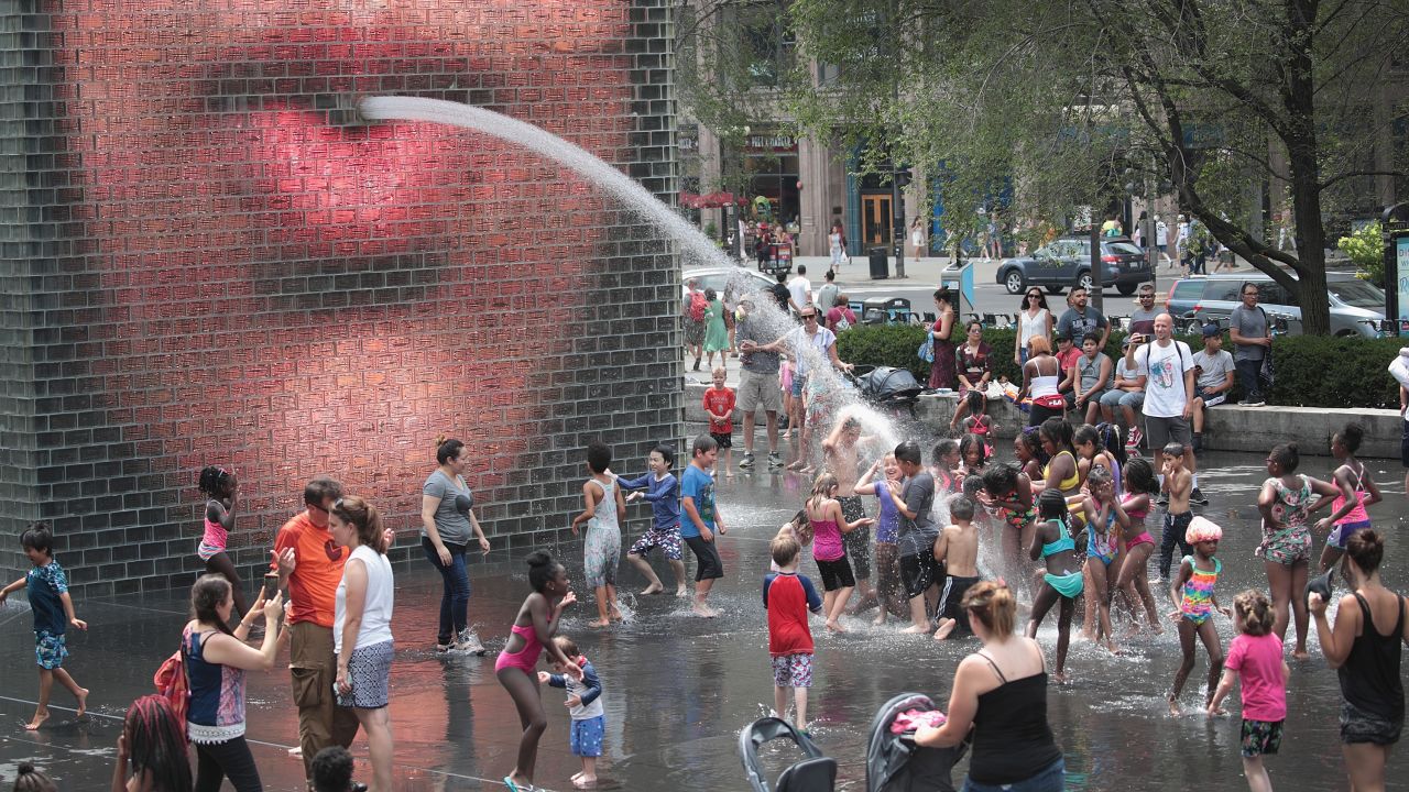 People cool off in downtown Chicago as temperatures climbed into the 90s on Friday, July 19. <a href="https://www.cnn.com/2019/07/20/weather/gallery/us-july-heat-wave/index.html" target="_blank">In pictures: Dangerous heat wave hits the US</a>