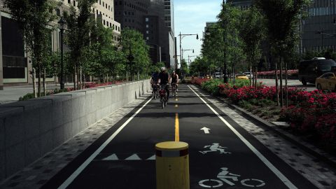 A group of cyclists ride along a dedicated bike lane in downtown Manhattan on May 29, 2016 in New York.