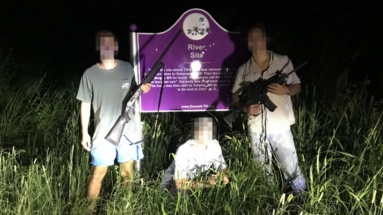 This photo, obtained by ProPublica, shows three University of Mississippi students in front of a roadside plaque commemorating Emmett Till. The faces in this image were obscured by CNN because it has not been able to reach the individuals for comment. 