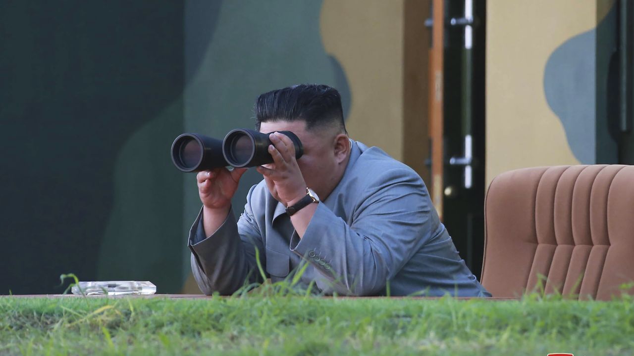 In this Thursday, July 25, 2019, photo provided on Friday, July 26, 2019, by the North Korean government, North Korean leader Kim Jong Un watches a missile test in North Korea. 