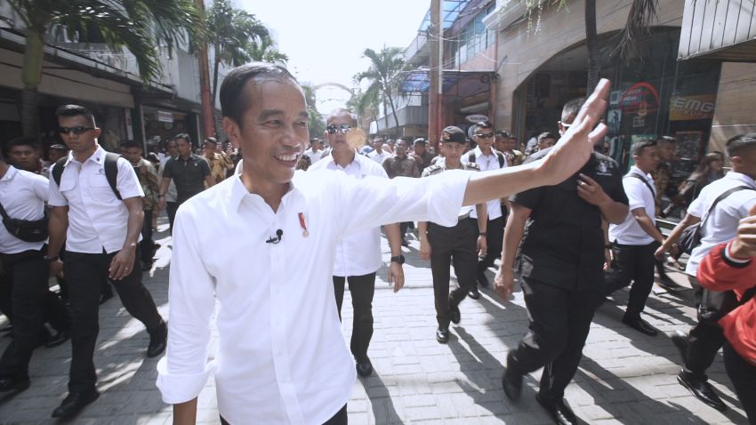 Indonesian President Joko Widodo greets people at the Pasar Baroe shopping center in central Jakarta.