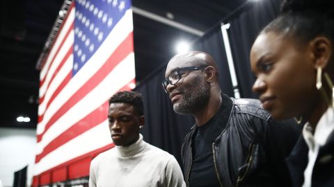 Anderson Silva, middle, meets reporters with two of his children after they became US citizens on July 23 in Los Angeles.