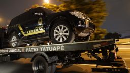 An imitation police truck used in the robbery at Sao Paulo-Guarulhos International Airport is towed away. 