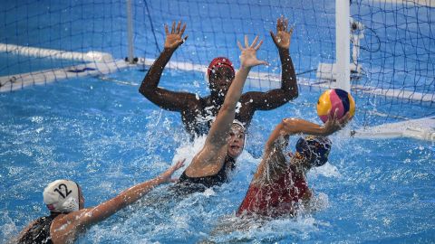 Spain's Maria Pena Carrasco throws the ball and US goalkeeper Ashleigh Johnson moves to block it during the women's final.