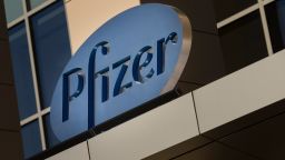 A sign for Pfizer pharmaceutical company is seen on a building in Cambridge, Massachusetts, on March 18, 2017. / AFP PHOTO / DOMINICK REUTER        (Photo credit should read DOMINICK REUTER/AFP/Getty Images)