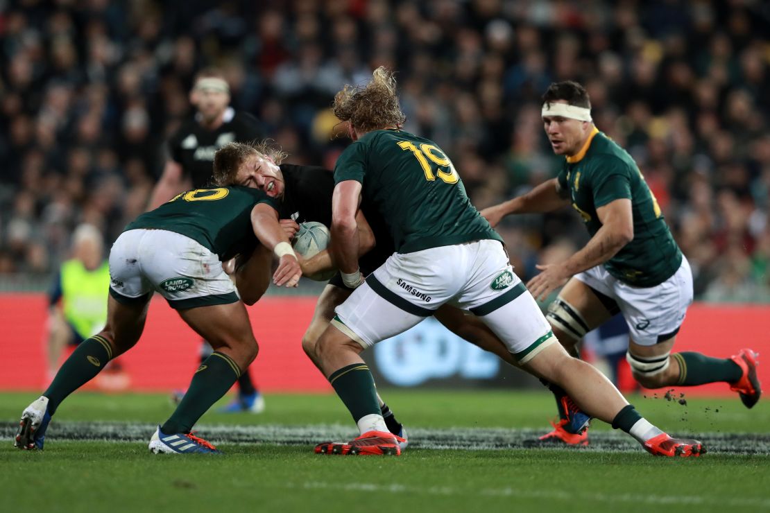 Jack Goodhue of the All Blacks charges forward against South Africa.