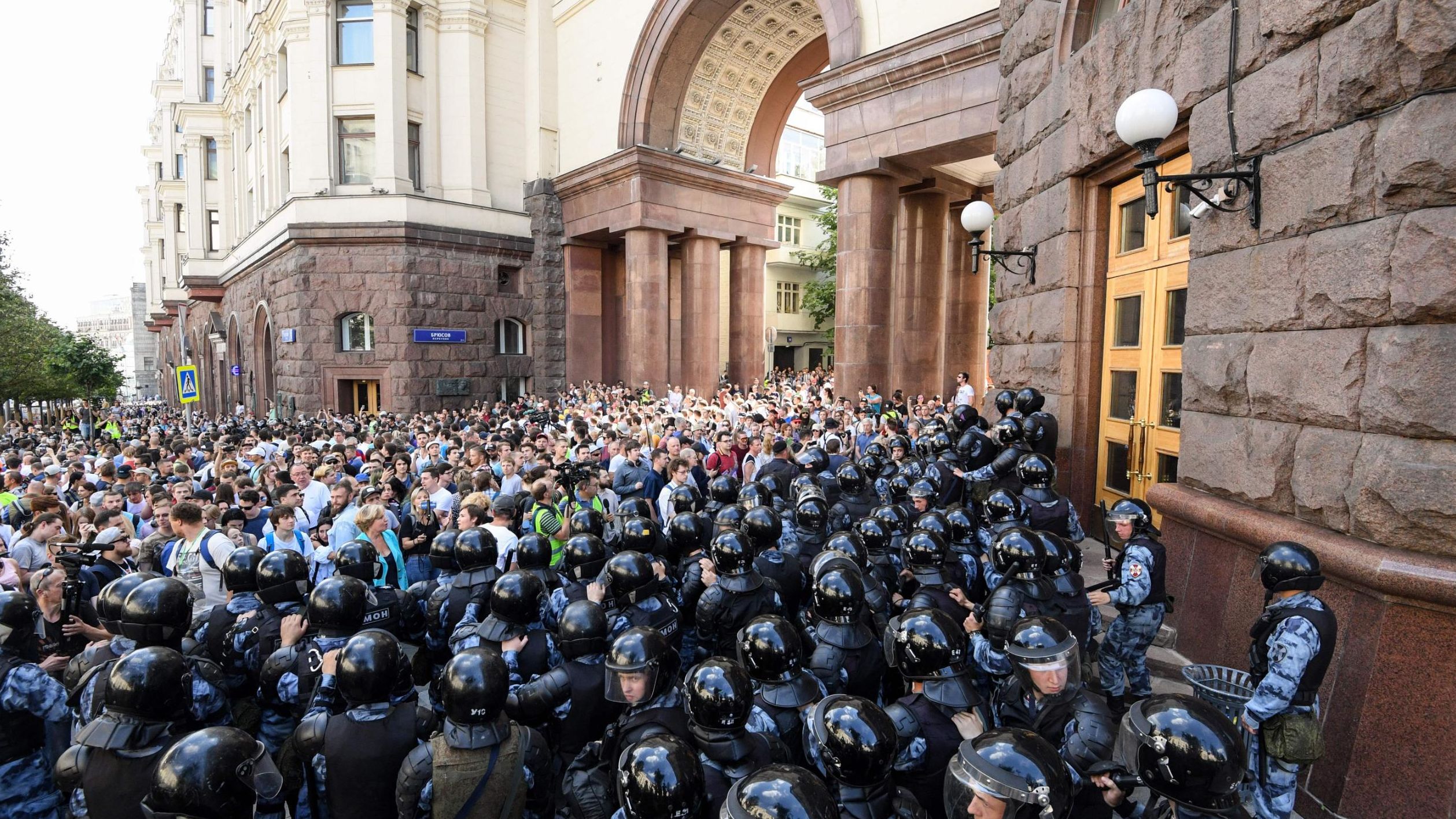 Protesters confront riot police in downtown Moscow on July 27.