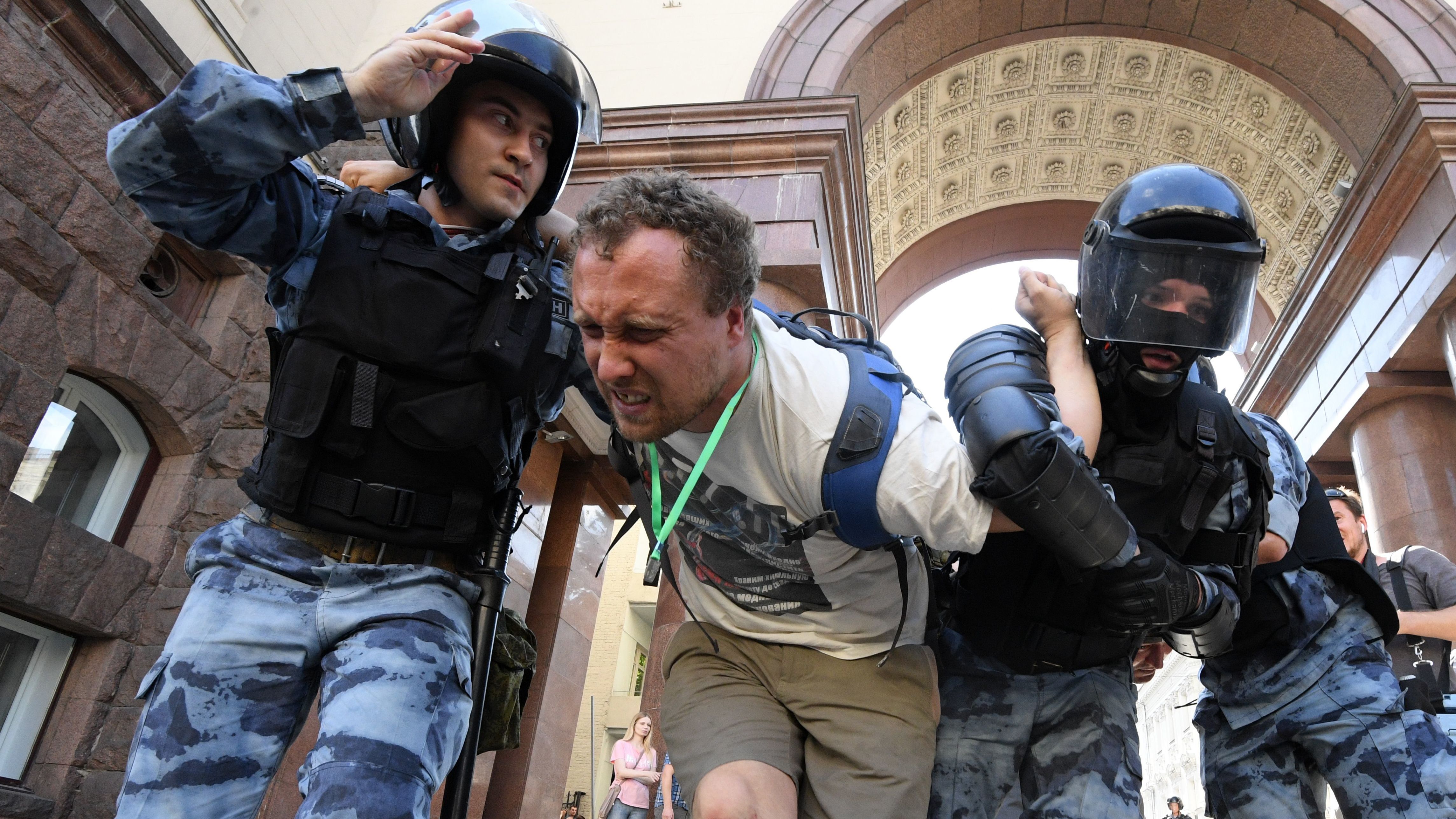 Members of the Russian National Guard detain a protester during an unauthorised rally in downtown Moscow on July 27, 2019.