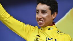 Colombia's Egan Bernal waves as he celebrates his overall leader's yellow jersey on the podium of the nineteenth stage of the 106th edition of the Tour de France cycling race between Saint-Jean-de-Maurienne and Tignes, in Tignes, on July 26, 2019. (Photo by JEFF PACHOUD / AFP)        (Photo credit should read JEFF PACHOUD/AFP/Getty Images)