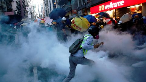 Demonstrators in Hong Kong clash with police during a protest against police violence during previous marches, July 28, 2019. 