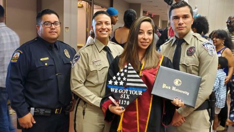 Jessica Ramirez and the El Paso officers at her graduation Saturday.