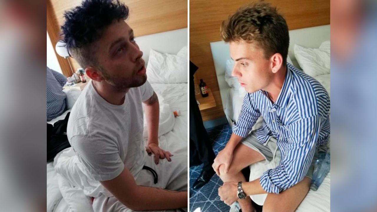 In this combo photo released by the Italian Carabinieri, Gabriel Christian Natale Hjorth, right, and Finnegan Lee Elder, sit in their hotel room in Rome.