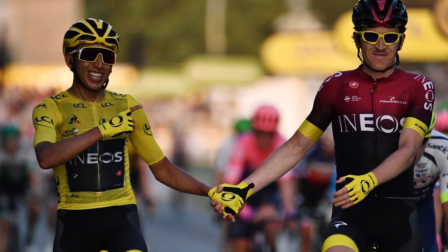 Colombia's Egan Bernal, wearing the overall leader's yellow jersey,  is congratulated by teammate Britain's Geraint Thomas as he celebrates his victory on the finish line of the 21st and last stage of the 106th edition of the Tour de France.