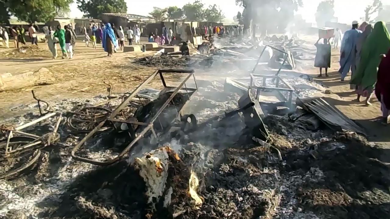 Smoldering ashes and charred items are seen on the ground in Budu near Maiduguri on July 28, 2019, after the latest attack by Boko Haram fighters on a funeral in northeast Nigeria has left 65 people dead. (Photo by Audu Marte / AFP)        (Photo credit should read AUDU MARTE/AFP/Getty Images)