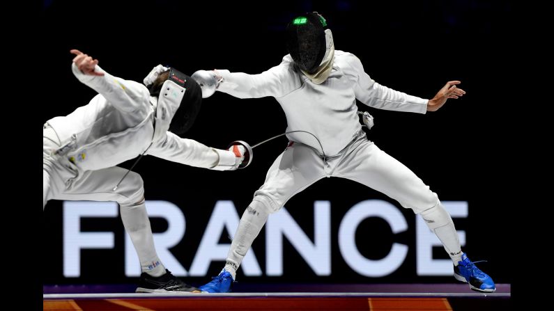 Roman Svichkar of Ukraine, left, lunges at Daniel Jerent of France during the men's epee team competition final at the FIE World Fencing Championships in Budapest, Hungary, on July 22.