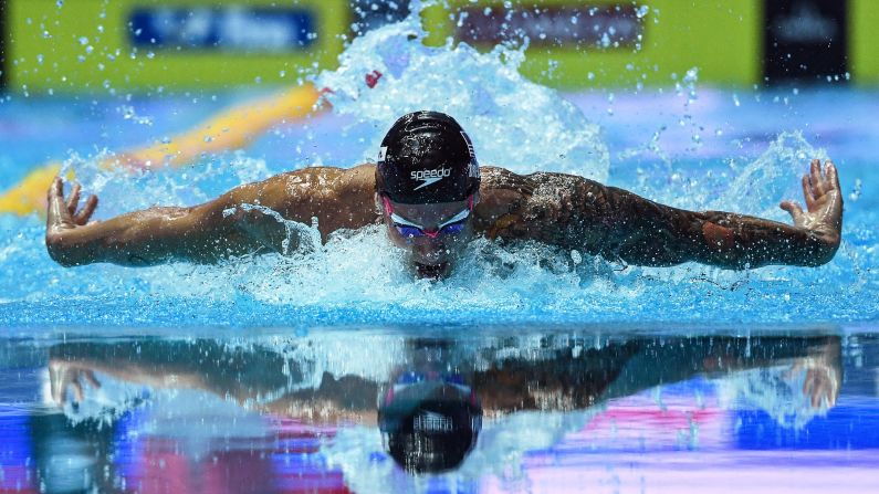 United States' swimmer Caeleb Dressel competes in the men's 100m butterfly final at the FINA World Swimming Championships in Gwangju, South Korea, on Saturday, July 27. The 22 year-old Dressel took home the gold medal and broke a decade-old <a href="index.php?page=&url=https%3A%2F%2Fwww.cnn.com%2F2019%2F07%2F26%2Fsport%2Fmichael-phelps-swimming-regan-smith-caeleb-dressel-trnd%2Findex.html" target="_blank">World Record</a> held by Michael Phelps.