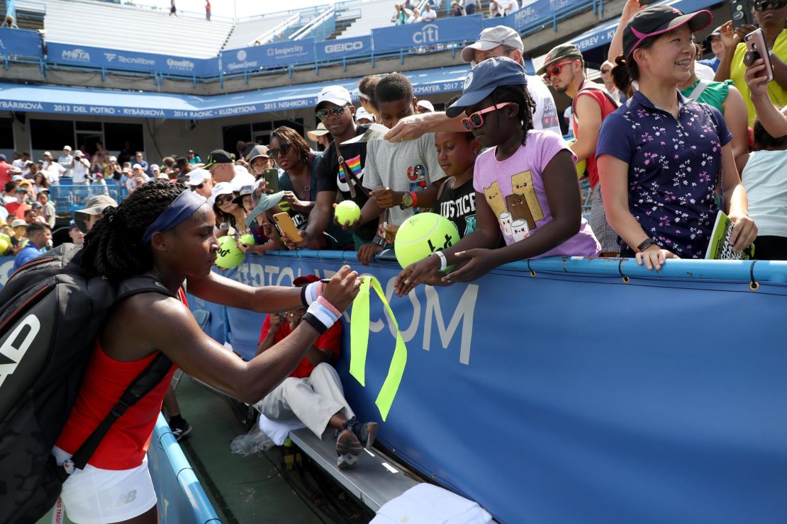 Cori "Coco" Gauff signs autographs after defeating Hiroko Kuwata at the Citi Open.