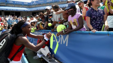 Cori "Coco" Gauff signs autographs after defeating Hiroko Kuwata at the Citi Open.