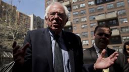 Senator Bernie Sanders, an independent from Vermont and 2016 Democratic presidential candidate, center, speaks to residents while touring the Twin Parks housing development in the Bronx borough of New York, U.S., on Monday, April 18, 2016. Sanders and Hillary Clinton engaged in their sharpest, testiest debate yet ahead of the New York presidential primary, but his barbs did little to knock Clinton off stride or to clarify his own plan for overhauling Wall Street. Photographer: Victor J. Blue/Bloomberg via Getty Images 