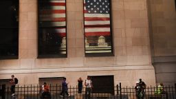 NEW YORK, NY - JULY 12:  An American flag is reflected in the window of a building across from the New York Stock Exchange (NYSE) on July 12, 2018 in New York City. As fears of a trade war eased with China, the Dow Jones Industrial Average rose 140 points in morning trading.  (Photo by Spencer Platt/Getty Images)