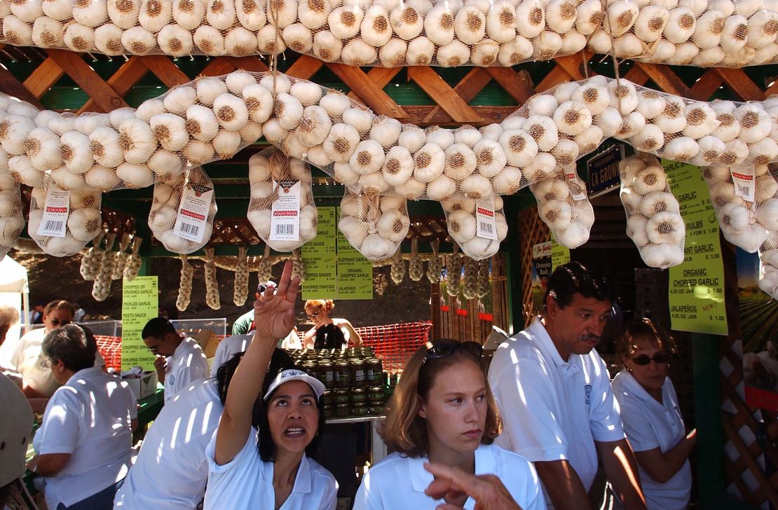 Vendors sell locally-grown garlic at the Gilroy Garlic Festival in Gilroy, Calif., on July 24, 2004.